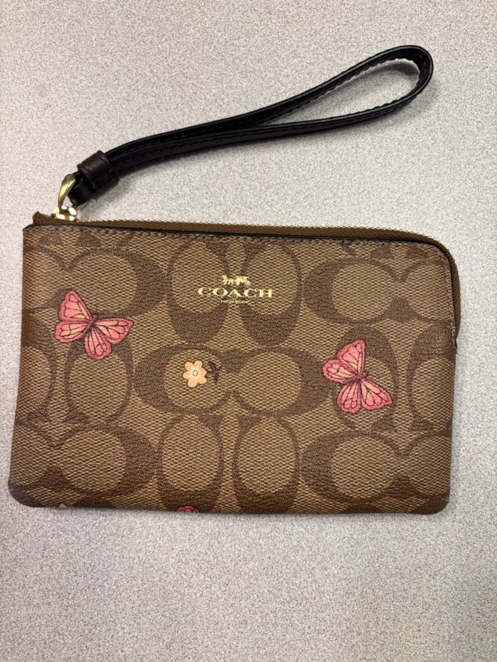 COACH Brown Signature Butterfly Wristlet with Pink Accents